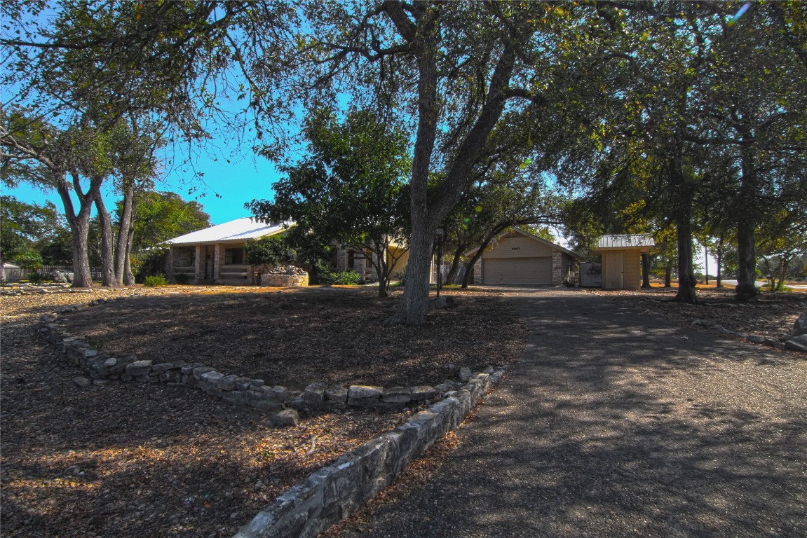 a view of outdoor space with deck and trees