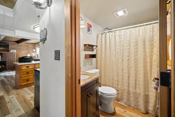 a bathroom with a toilet a sink and a shower
