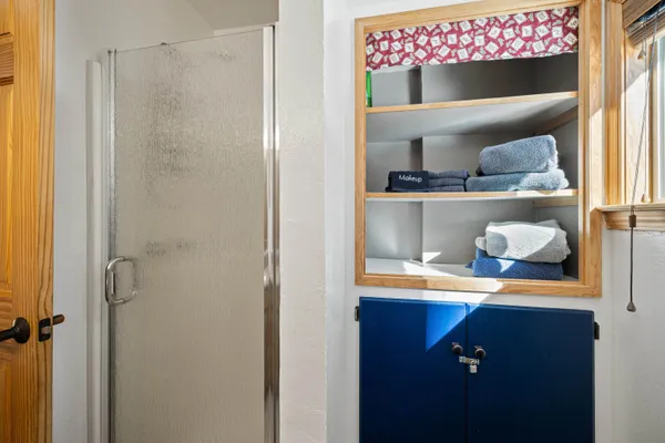 a room with a walk in closet and a window