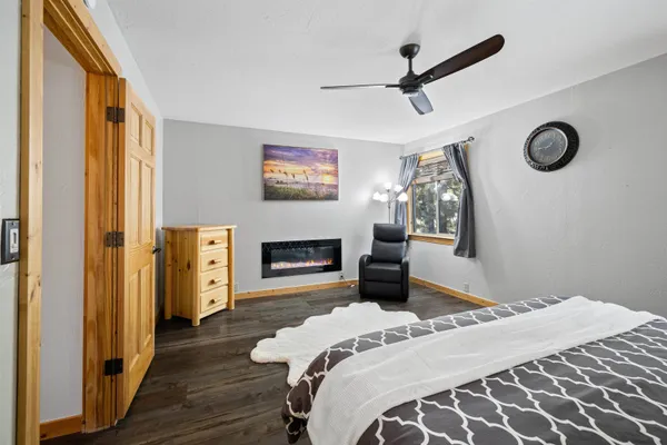 a bedroom with a bed and a fireplace