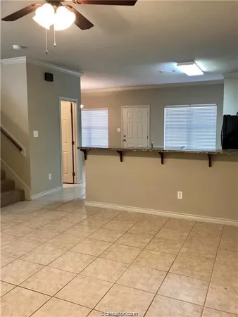 a view of a kitchen with furniture and a kitchen