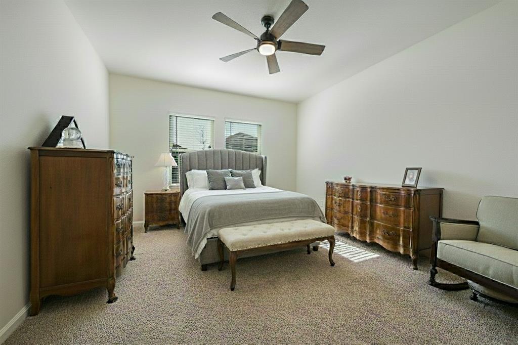 801 Peach Tree Lane Anna, TX 75409 - Photo 8 of 14 a bed room with a bed and a couch
