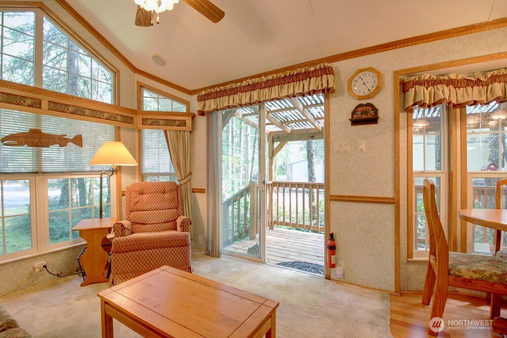 134 Drial Loop Maple Falls, WA 98266 - Photo 10 of 36 a living room with furniture a ceiling fan and a window