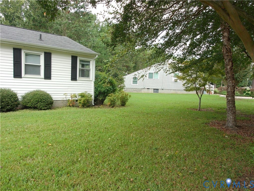 3284 Chickahominy Road Toano, VA 23168 - Photo 2 of 26 White siding exterior with black window shutters