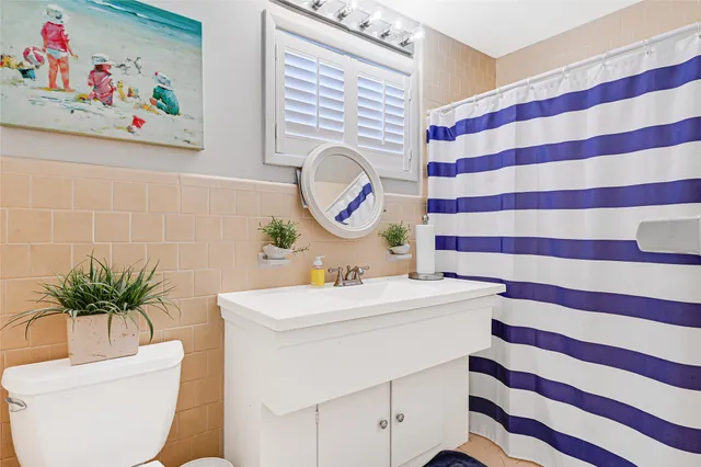a bathroom with a sink a toilet and a bathtub