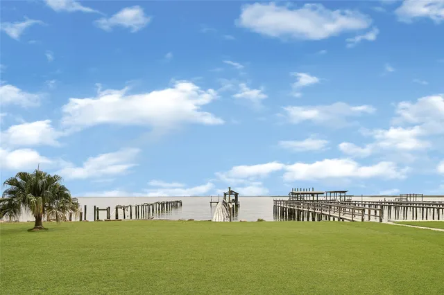 a view of houses with an ocean and city view