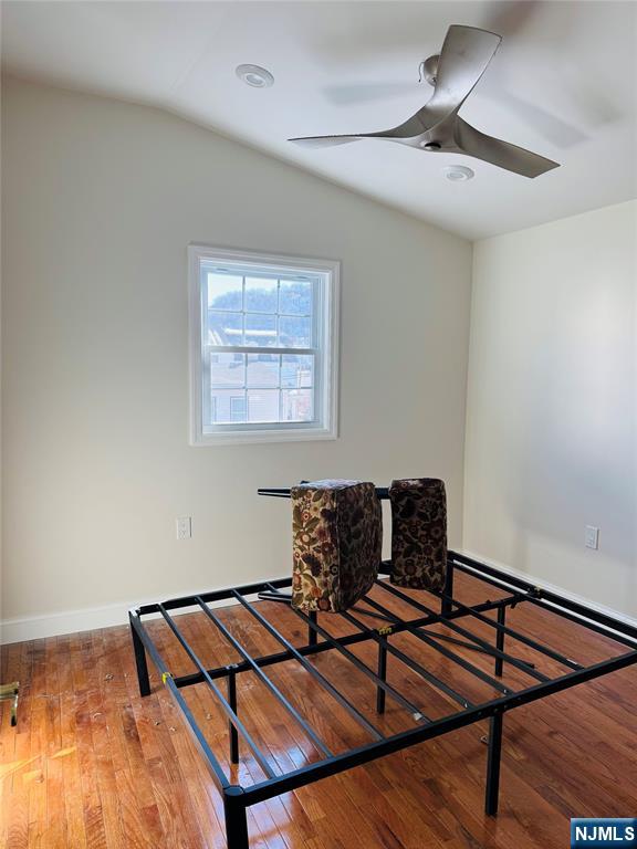 14 Elm Street Paterson, NJ 07501 - Photo 7 of 11 a living room with a bed and a desk