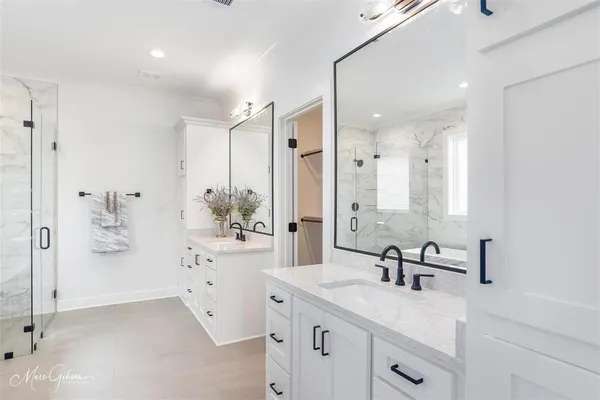 a bathroom with a bathtub and a shower