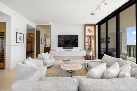 a living room with furniture fireplace and a flat screen tv