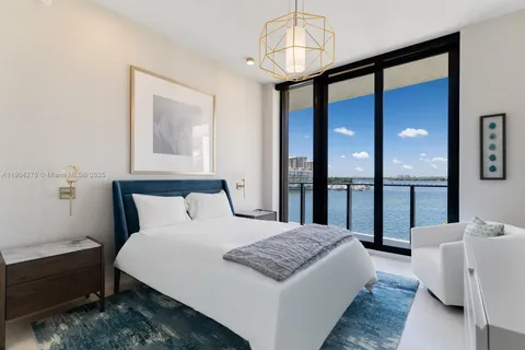 a bedroom with bed and a window