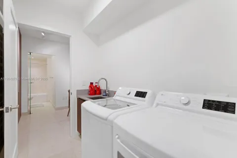 a utility room with dryer and washer