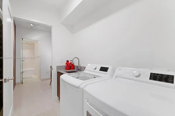 a utility room with dryer and washer