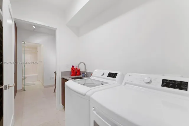 a utility room with dryer and washer