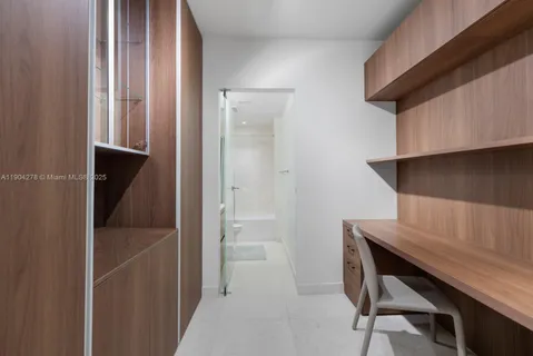 a view of room with wooden floor