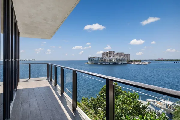 a view of balcony with wooden floor