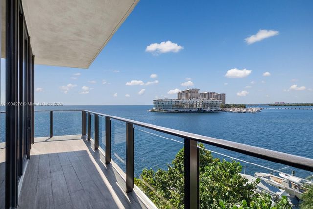 a view of balcony with wooden floor