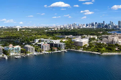 a view of a lake with a building and outdoor space