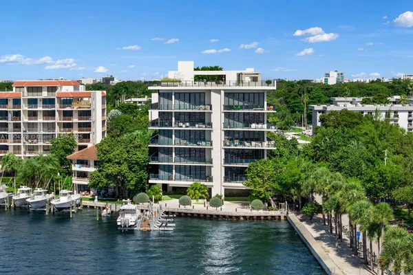an aerial view of a house with garden space and street view