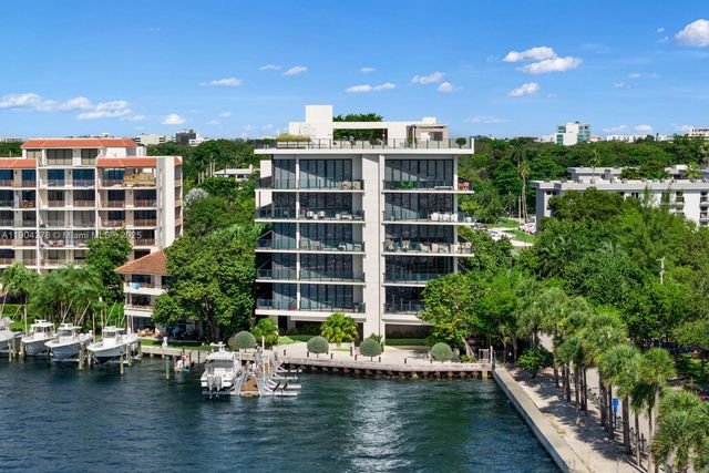 an aerial view of a house with garden space and street view