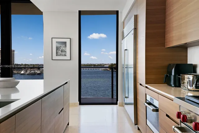 a view of a kitchen from the hallway