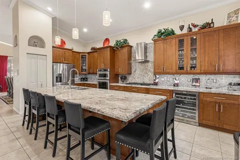 a kitchen with a table and chairs in it
