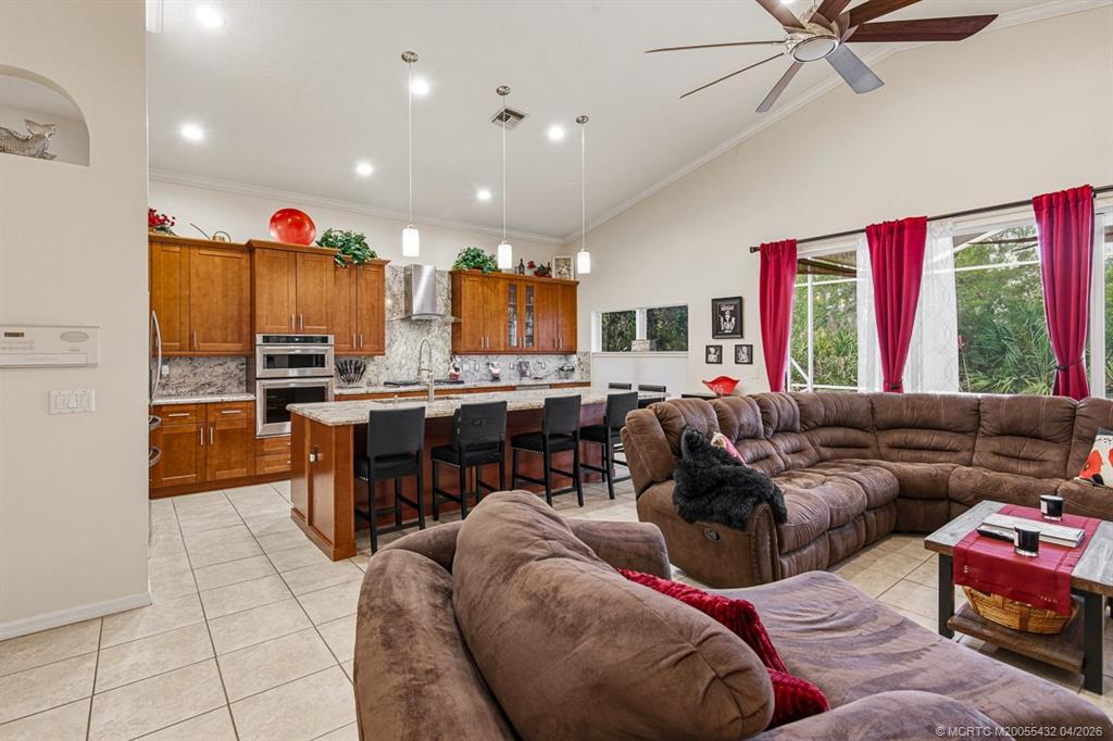 7213 Southeast Magellan Lane Stuart, FL 34997 - Photo 15 of 47 a living room with furniture kitchen and a window