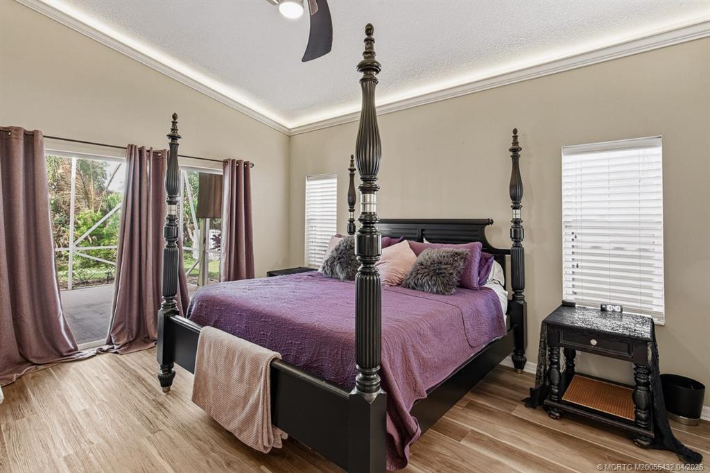 7213 Southeast Magellan Lane Stuart, FL 34997 - Photo 18 of 47 a bedroom with a bed and a window