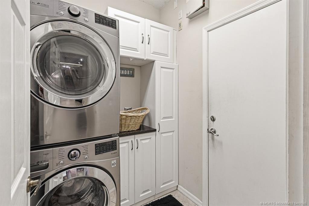 7213 Southeast Magellan Lane Stuart, FL 34997 - Photo 23 of 47 a utility room with dryer and washer