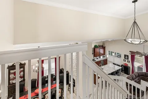a view of a livingroom with furniture and stairs