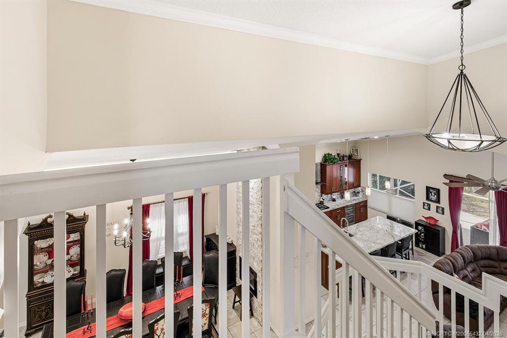 7213 Southeast Magellan Lane Stuart, FL 34997 - Photo 27 of 47 a view of a livingroom with furniture and stairs