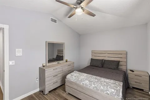 a bedroom with a bed and a dresser
