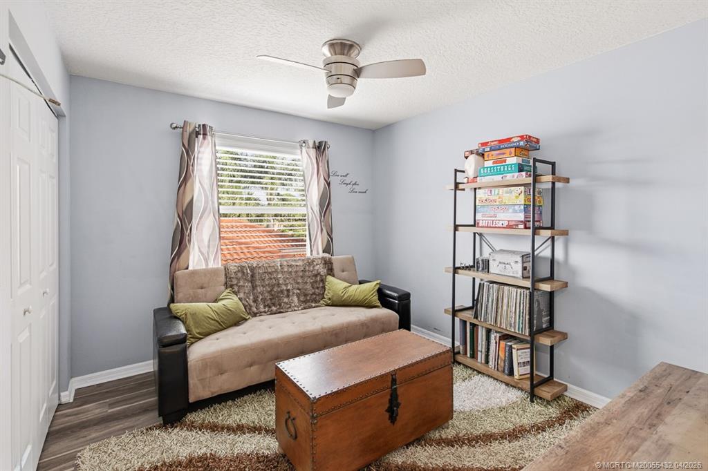 7213 Southeast Magellan Lane Stuart, FL 34997 - Photo 33 of 47 a living room with furniture and a window