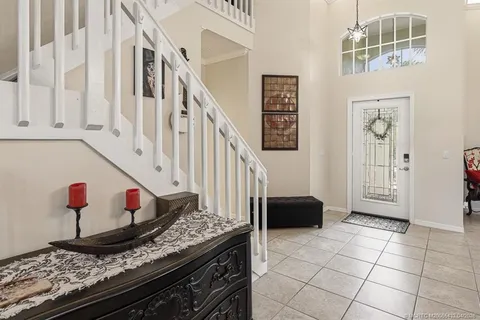 a view of an entryway and kitchen with sink