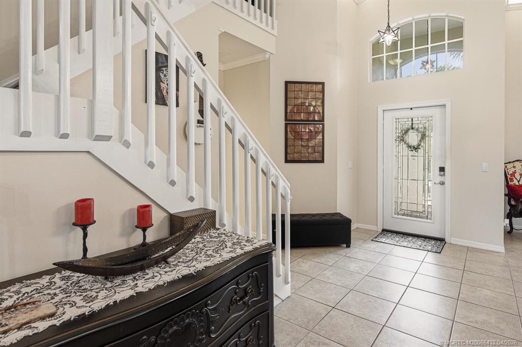 7213 Southeast Magellan Lane Stuart, FL 34997 - Photo 4 of 47 a view of an entryway and kitchen with sink