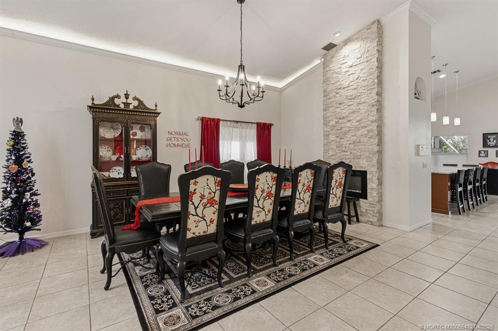 7213 Southeast Magellan Lane Stuart, FL 34997 - Photo 6 of 47 a view of a dining room with furniture