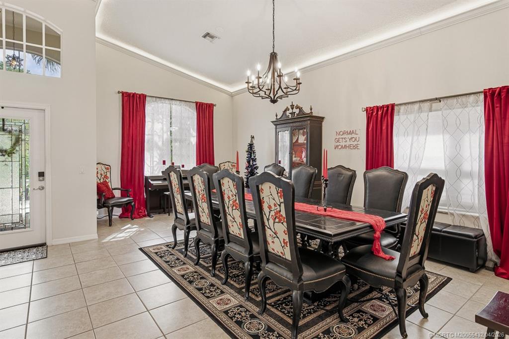 7213 Southeast Magellan Lane Stuart, FL 34997 - Photo 7 of 47 a view of a dining room with furniture
