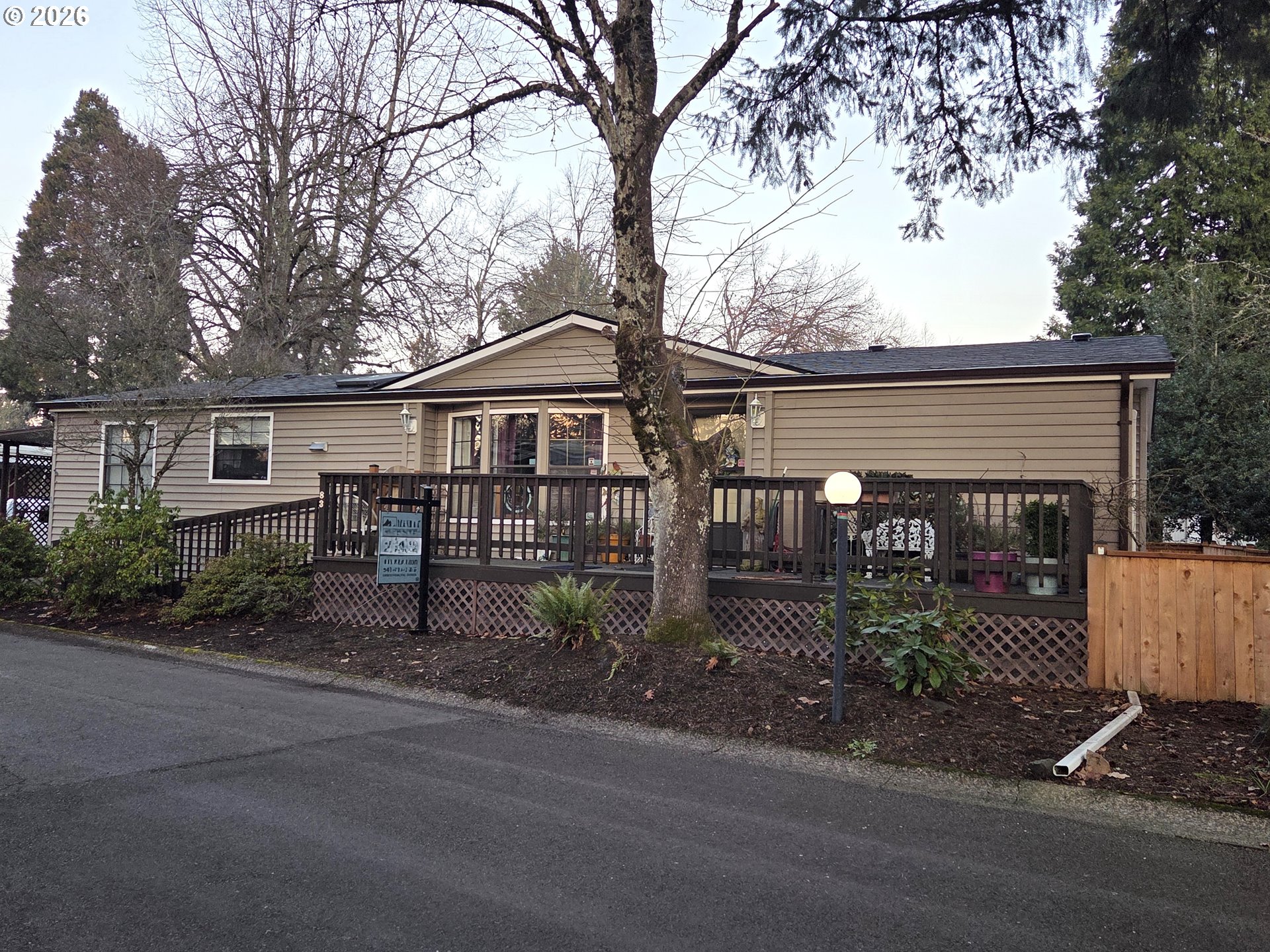 1475 Green Acres Road, Unit 83 Eugene, OR 97408 - Photo 23 of 37 a front view of a house with garden