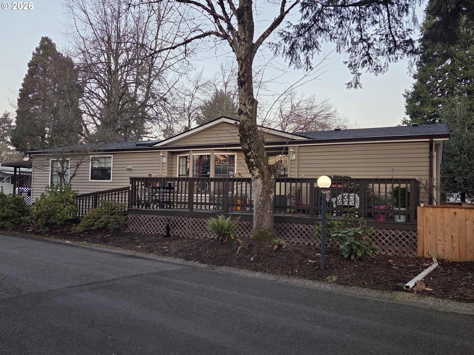 1475 Green Acres Road, Unit 83 Eugene, OR 97408 - Photo 27 of 37 a view of a house with a yard