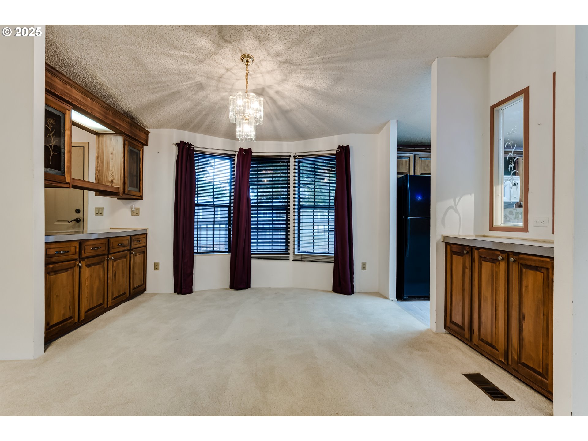 1475 Green Acres Road, Unit 83 Eugene, OR 97408 - Photo 8 of 19 a view of an empty room with a kitchen