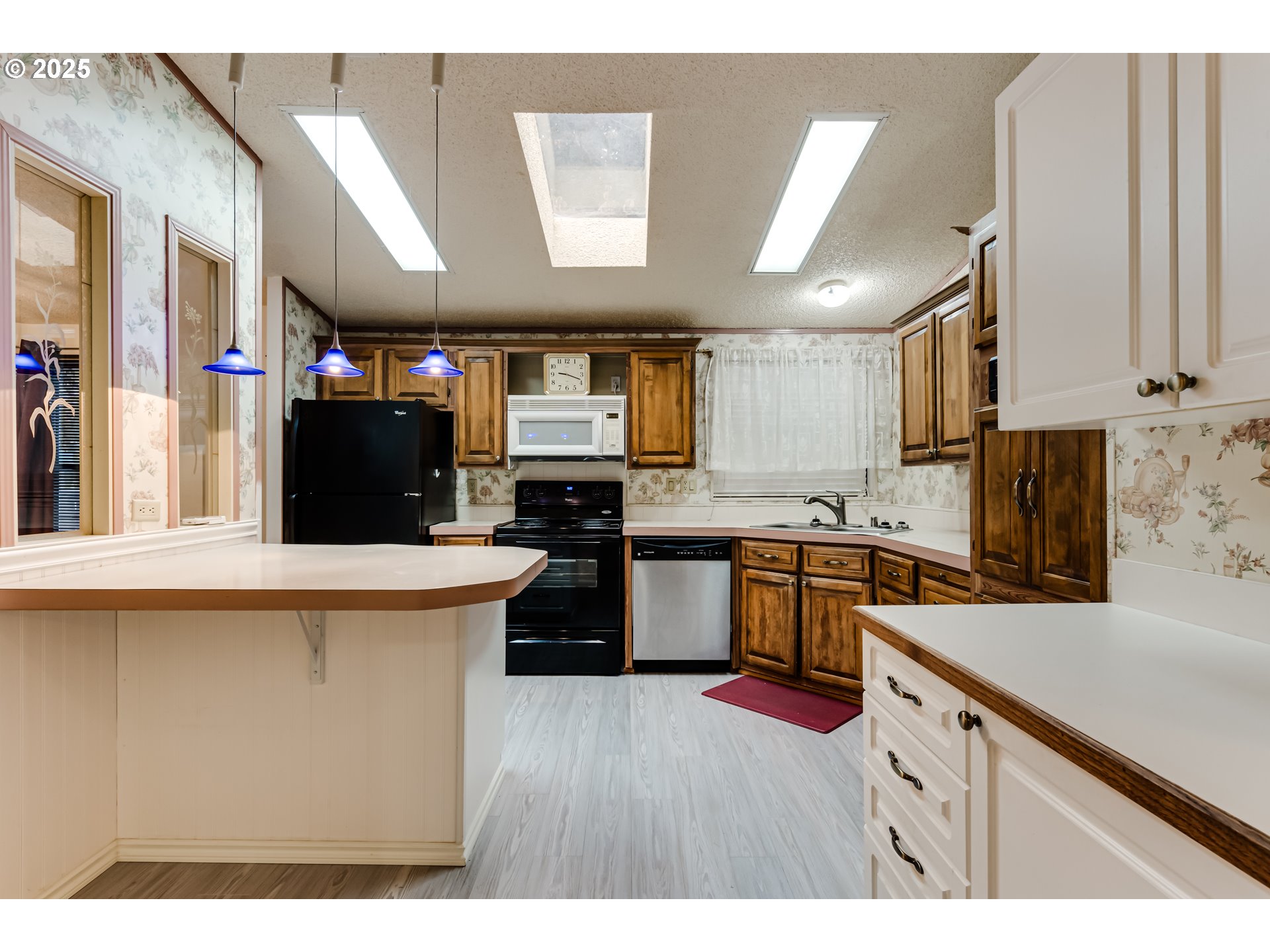 1475 Green Acres Road, Unit 83 Eugene, OR 97408 - Photo 10 of 19 a kitchen with stainless steel appliances granite countertop a stove and a refrigerator