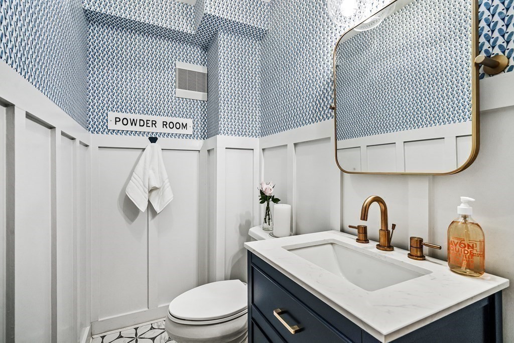 229 Weston Road Wellesley, MA 02482 - Photo 11 of 24 a bathroom with a sink toilet and shower