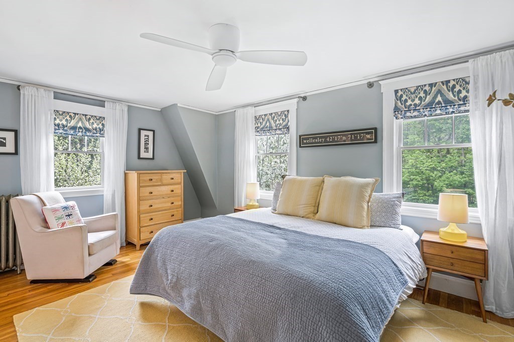 229 Weston Road Wellesley, MA 02482 - Photo 13 of 24 a bedroom with a bed and wooden floor