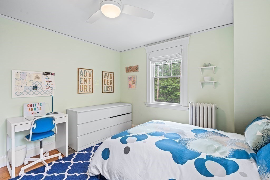 229 Weston Road Wellesley, MA 02482 - Photo 16 of 24 a bedroom with a bed and wooden floor