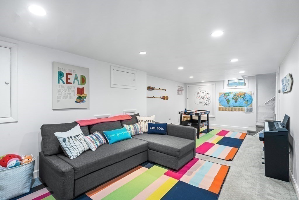 229 Weston Road Wellesley, MA 02482 - Photo 18 of 24 a living room with furniture and a couch