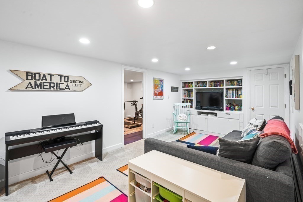 229 Weston Road Wellesley, MA 02482 - Photo 19 of 24 a living room with furniture and a flat screen tv