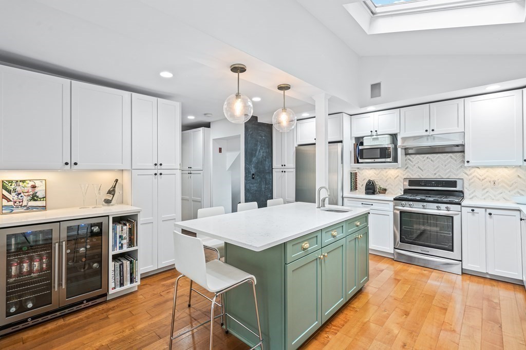 229 Weston Road Wellesley, MA 02482 - Photo 8 of 24 a kitchen that has a lot of cabinets a sink and a stove in it