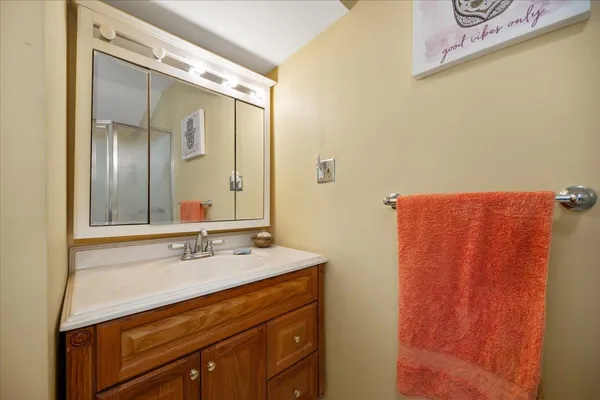 a kitchen with granite countertop cabinets stainless steel appliances and a window