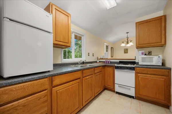a living room with furniture ceiling fan and a rug