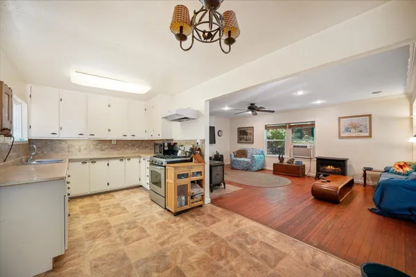 a view of a kitchen with furniture and a fireplace