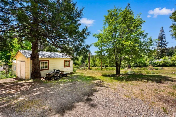 a backyard of a house with lots of green space